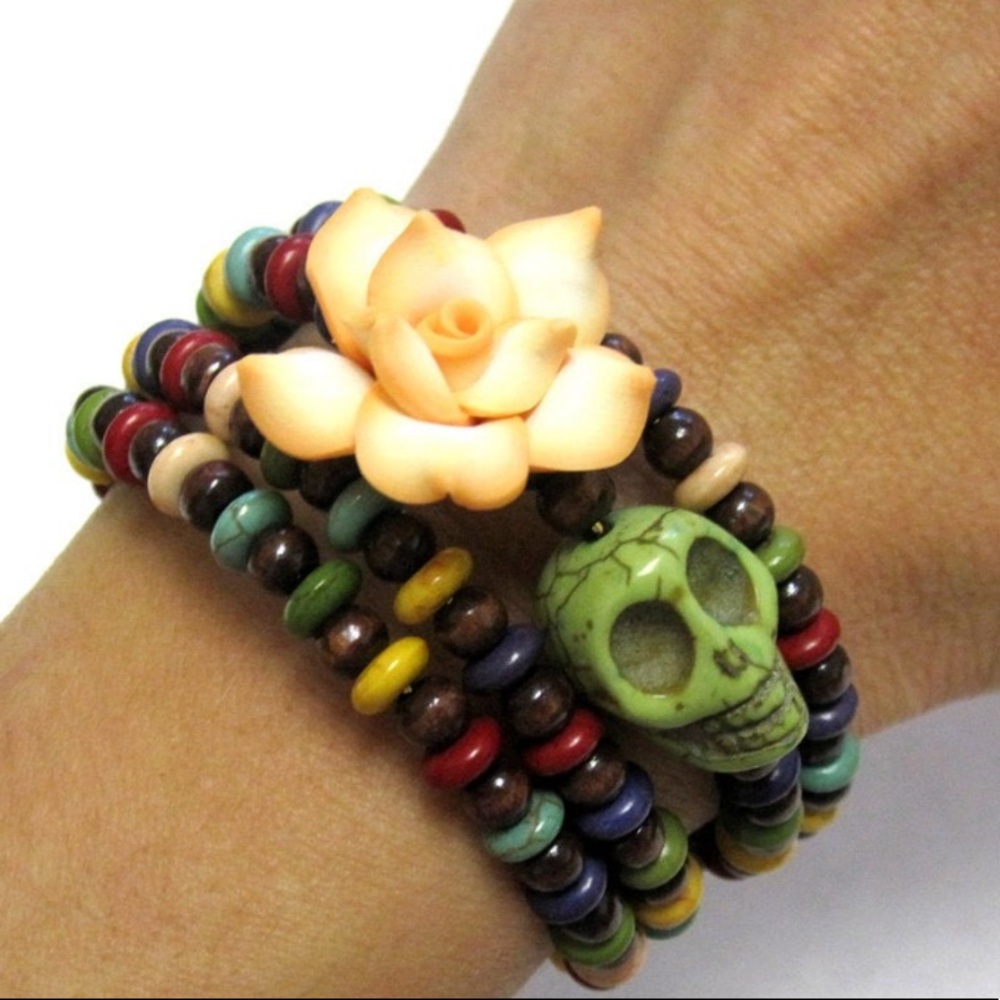 Color full wooden beads on memory wire bracelet with skull and flower.